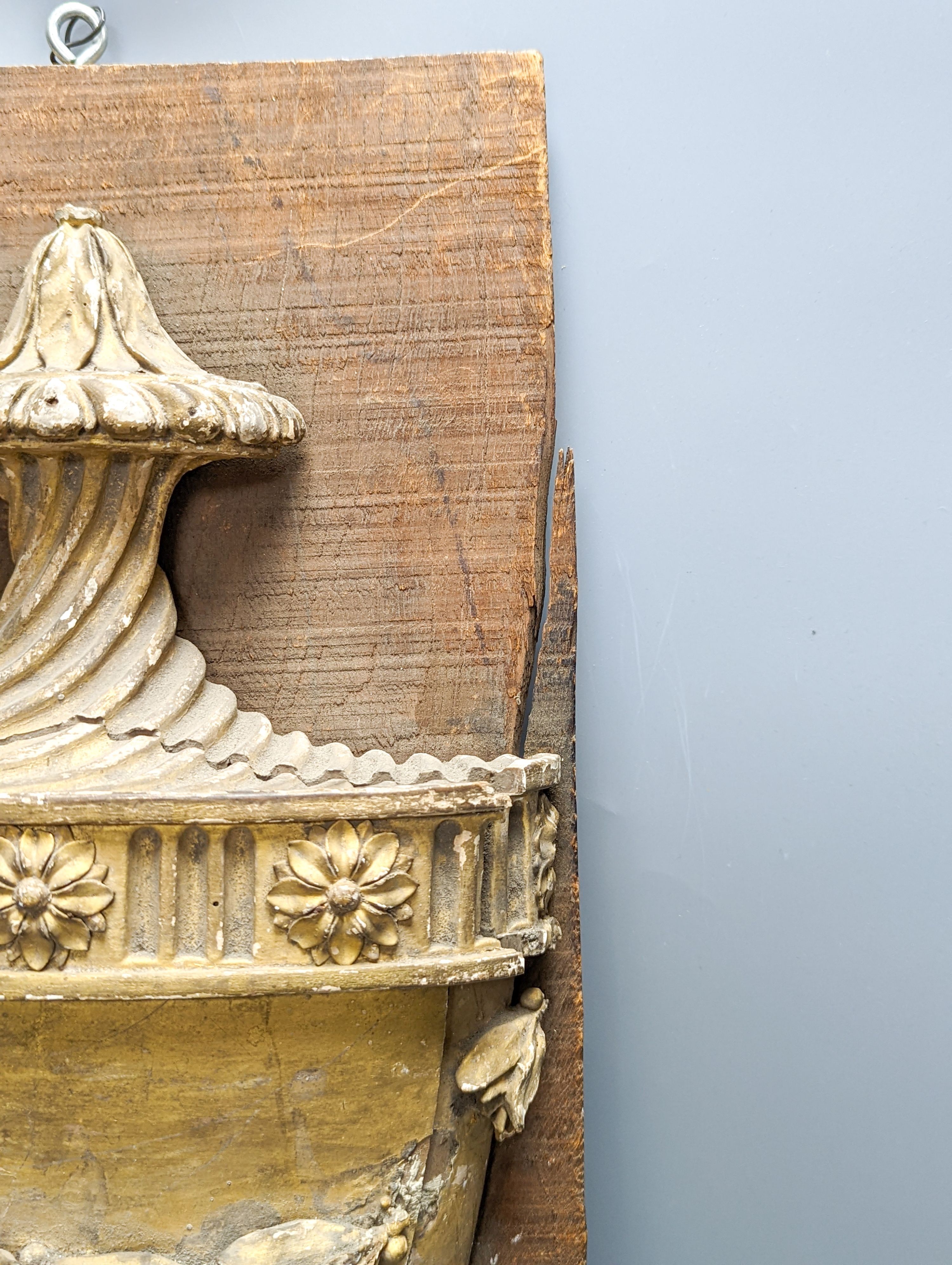 An 18th/19th century carved wood and gilt gesso urn relief, later mounted, 57x23cm